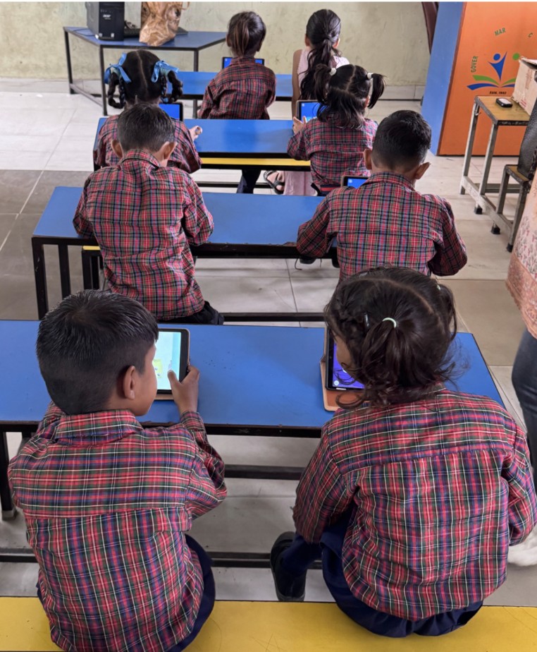 A classroom of students each working through math practice on their own tablet