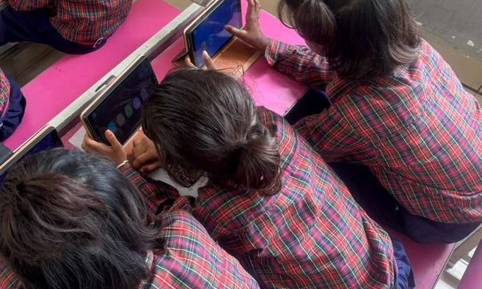 Primary school students using tablets for adaptive math practice